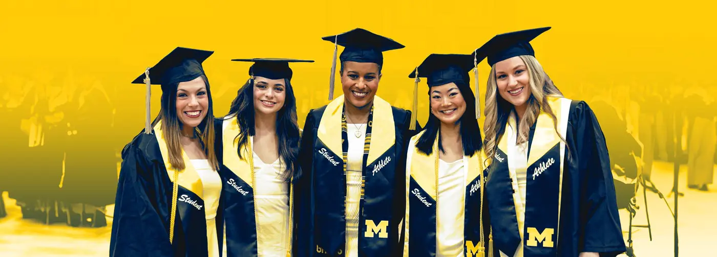 Graduates posing together