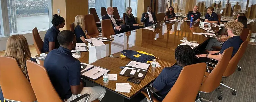 people sitting around conference table