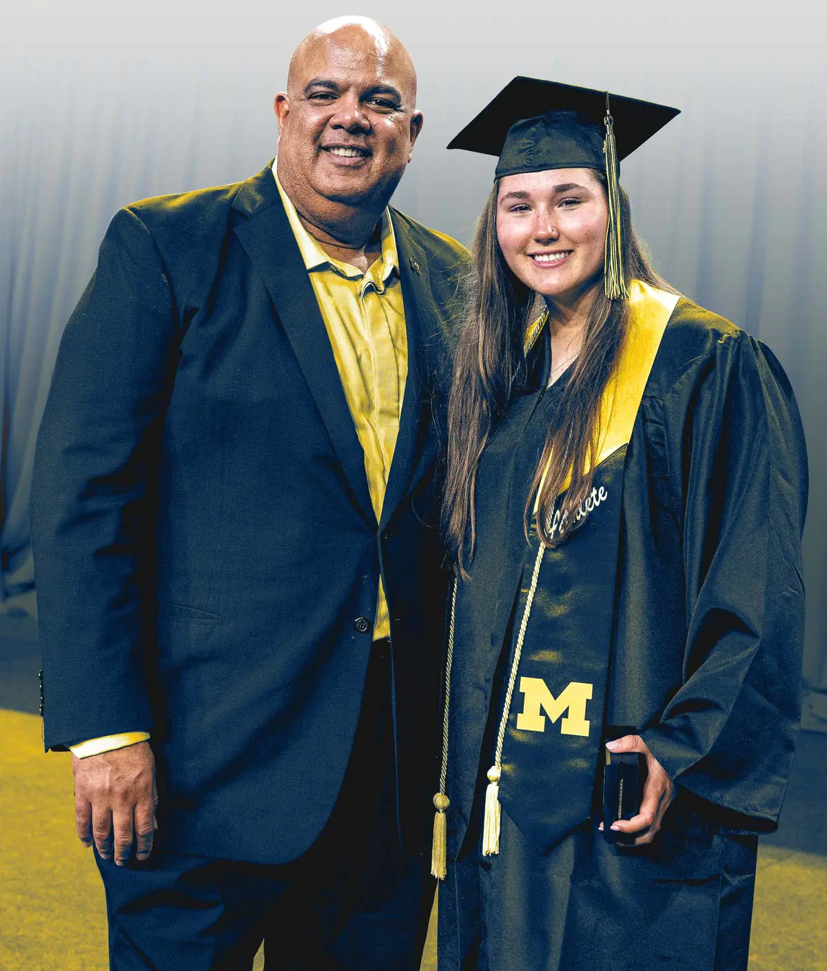 Man posing with graduate
