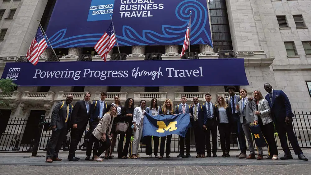 students in front of building