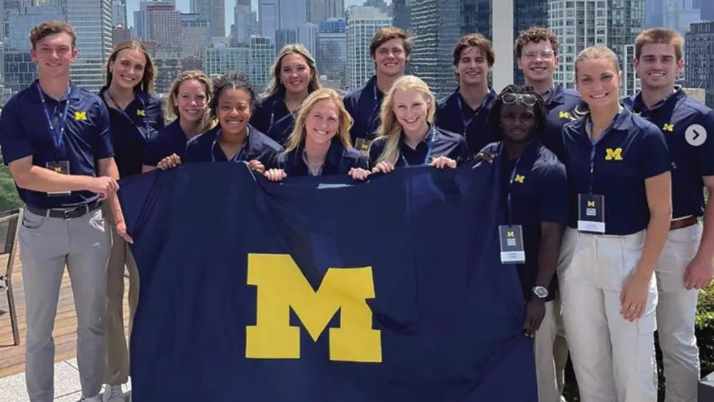 students holding michigan flag in the city