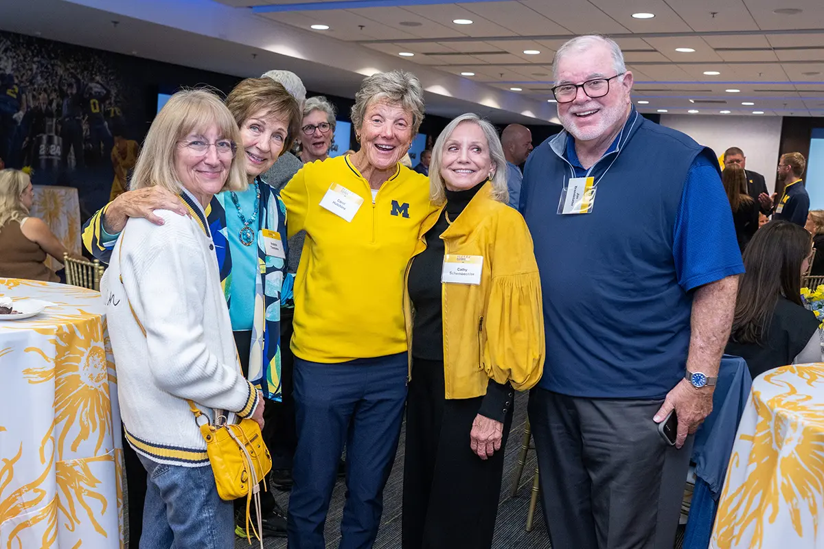 Attendees posing together for a photo at the 2026 Women in Sports Elevate HER Summit